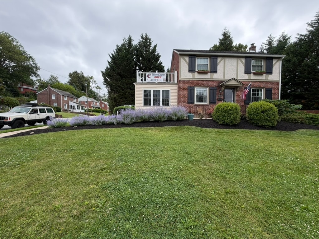 Refreshed front entrance planting bed after seasonal cleanup in Drexel Hill, PA